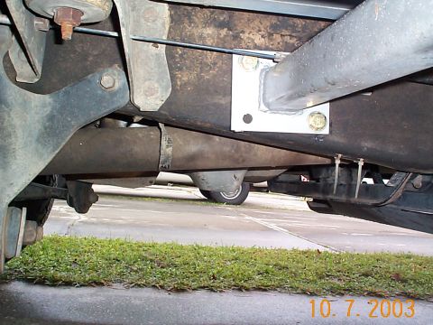 1992 Ford Bronco - driver's side front pad mount. There is a fuel line bracket that runs behind this mount, bolts to the brack must be removed and the bracket…