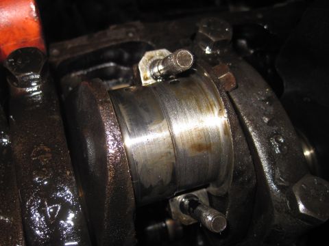 1979 Ford Bronco - Close-up of an engine crankshaft bearing, showing signs of wear and oil. The registry claims this is from a 1979 Ford Bronco.