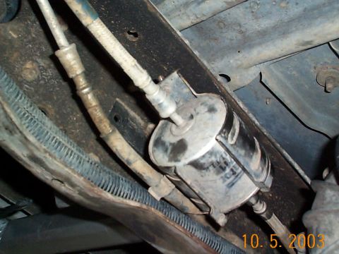1992 Ford Bronco - This is behind the rear pad mount on the driver's side. You must remove the bolts holding the fuel filter bracket on. Once the pad is mount…