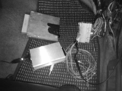 1995 Ford Probe - Close-up of automotive electronics and wiring, possibly for aftermarket installation or repair.