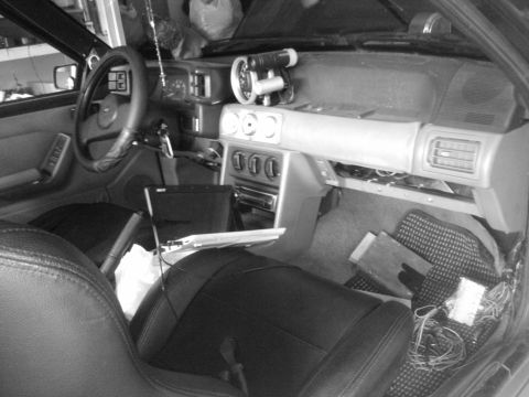 1995 Ford Probe - Interior view of a car, showing the dashboard with aftermarket gauges and wiring.