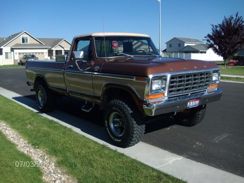 1979 Ford F-150 - This 1979 Ford F-150 pickup truck features a two-tone brown and tan paint scheme and a prominent chrome grille.