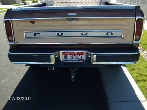 1979 Ford F-150 - The rear of a 1979 Ford F-150 pickup truck, showing the tailgate with 'FORD' lettering and an Idaho license plate.