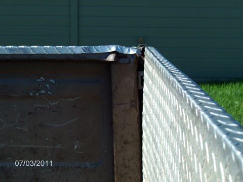 1979 Ford F-150 - Close-up of a truck bed corner with diamond plate trim, dated 07/03/2011.