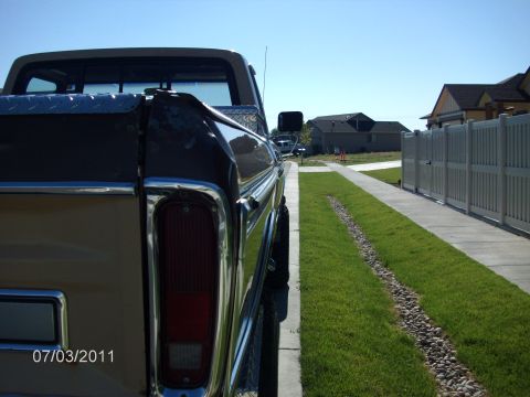 1979 Ford F-150 - Rear view of a 1979 Ford F-150 pickup truck parked on a residential street.