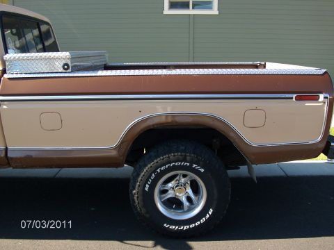 1979 Ford F-150 - This 1979 Ford F-150 pickup features a two-tone brown and tan paint scheme on its bed and cab.