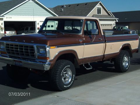 1979 Ford F-150 - This 1979 Ford F-150 pickup truck is shown from a three-quarter front angle in front of a residential garage.