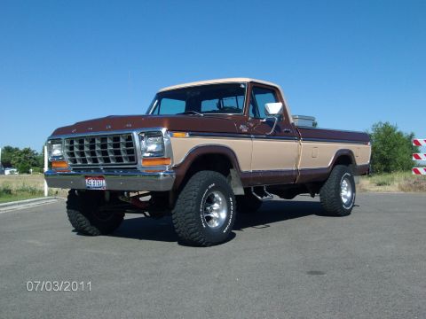 1979 Ford F-150 - This 1979 Ford F-150 pickup truck features a two-tone brown and tan paint scheme and lifted suspension.