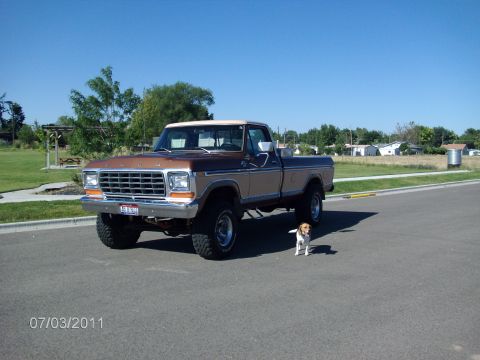 1979 Ford F-150 - A 1979 Ford F-150 pickup truck is shown from a three-quarter front angle on a sunny day.