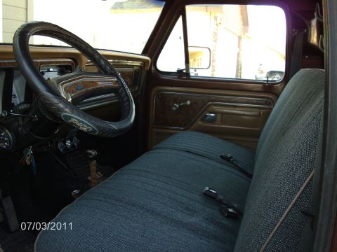 1979 Ford F-150 - Interior of a 1979 Ford F-150 pickup truck, the original steering wheel and seat upholstery.