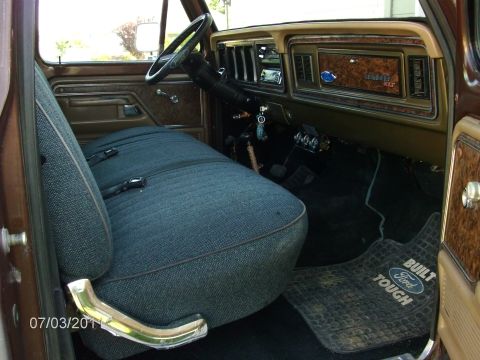 1979 Ford F-150 - Interior view of a 1979 Ford F-150, showing the bench seat, dashboard, and floor mat.