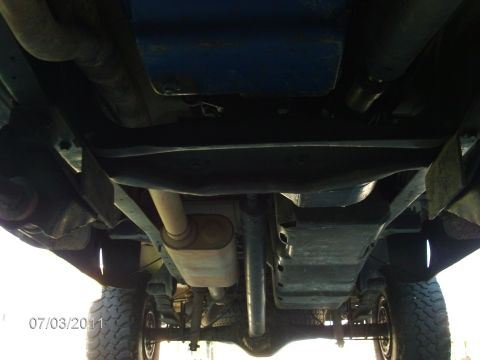 1979 Ford F-150 - The underside of a truck is shown, revealing the exhaust system, suspension, and drivetrain components. The date 07/03/2011 is visible.