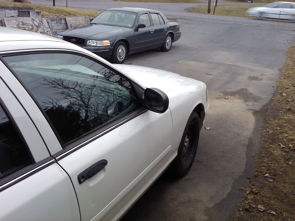 White 2000 Ford Crown Victoria front quarter panel and door