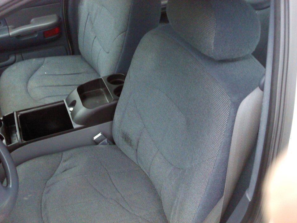 2000 Ford Crown Victoria interior showing front cloth seats and center console with cup holders