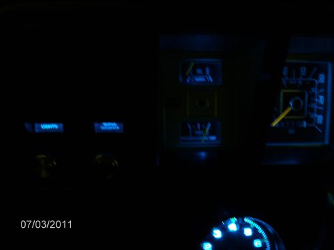 1979 Ford F-150 - Interior view of a vehicle's dashboard gauges illuminated with blue LED lights.
