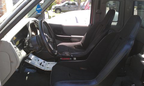 1992 Ford Ranger - Interior view of a 1992 Ford Ranger, racing seats and a modified dashboard area.