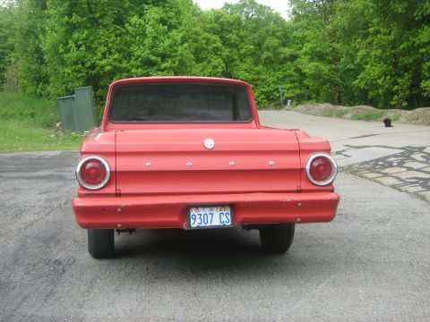 1964 Ford Ranchero - Rear view of a red 1964 Ford Ranchero pickup truck parked outdoors.