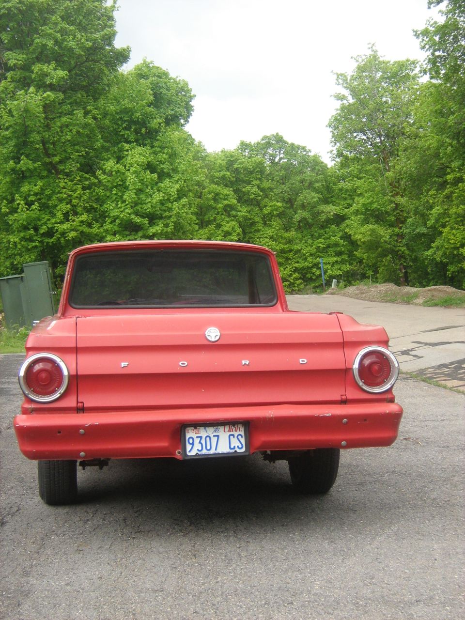1964 Ford Ranchero rear view with red paint and license plate 9307 CS
