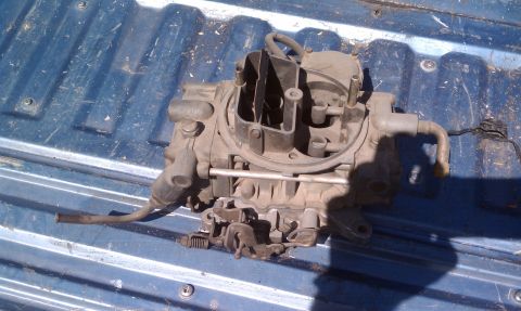 1979 Ford Bronco - Holley carburetor shown on a blue truck bed. No year or vehicle information is visible.