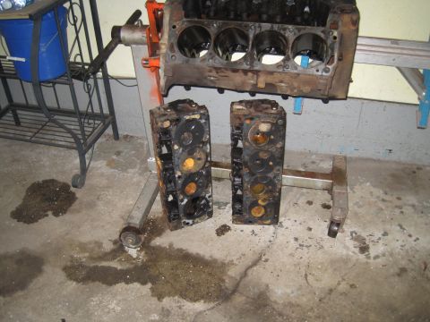 1979 Ford Bronco - Engine block and cylinder heads disassembled and resting on stands.