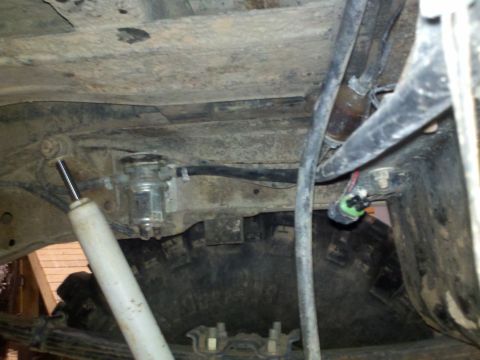1979 Ford Bronco - Undercarriage components including a fuel filter and shock absorber are visible.