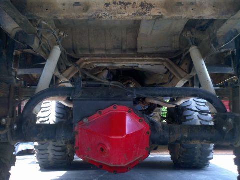 1979 Ford Bronco - Undercarriage detail of a vehicle, highlighting the rear axle and differential cover.