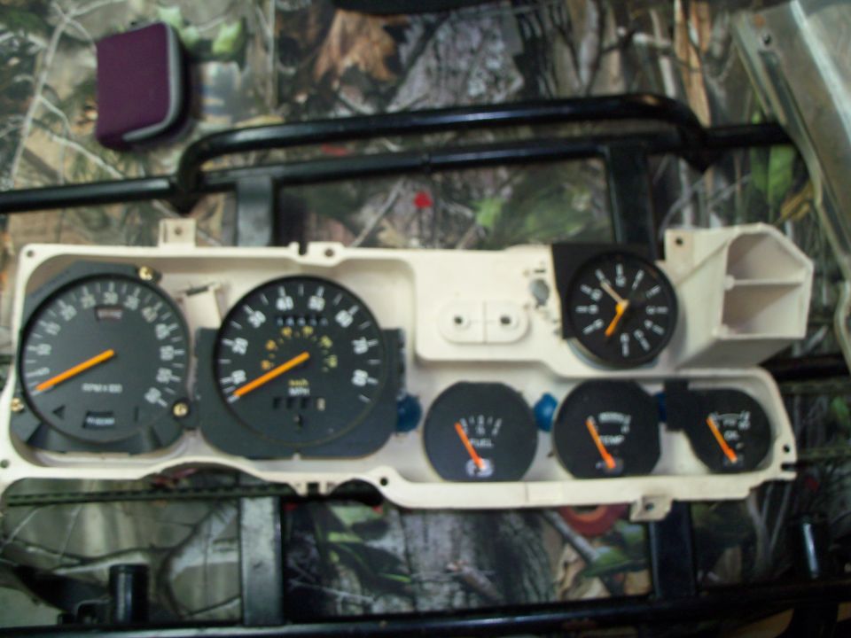 Removed instrument cluster gauge panel with speedometer tachometer and gauges