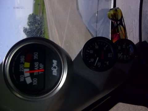 1994 Ford F-150 - Interior view of B&M gauges: transmission temp, oil pressure, and water temp.
