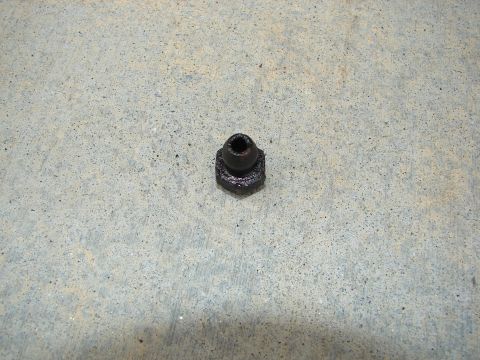1992 Ford Taurus - A single black brake line fitting rests on a concrete surface.