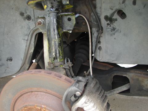 1992 Ford Taurus - Front brake assembly showing rotor, caliper, and suspension parts.