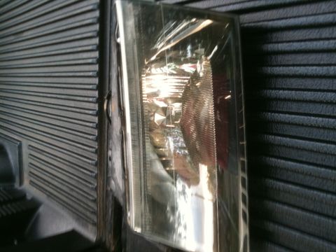 1993 Ford Crown Victoria - Headlight assembly shown in detail, likely a replacement part.