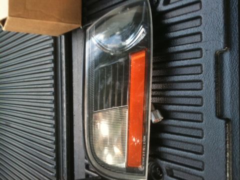 1993 Ford Crown Victoria - A close-up view of a vehicle's tail light assembly, showing its internal structure and orange reflector.