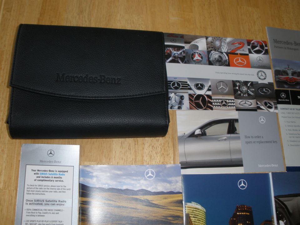 Black Mercedes-Benz owner's manual case with brochures and inserts