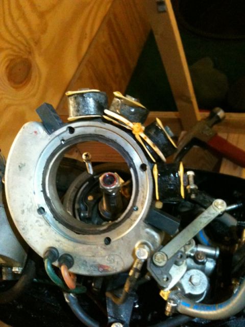1991 Ford Bronco - Close-up view of an outboard motor's ignition coil assembly, held together with yellow wire ties.