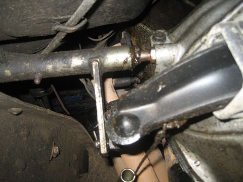 1983 Chevrolet C/K Pickup - Underside view of a vehicle's clutch linkage system, focusing on mechanical components.
