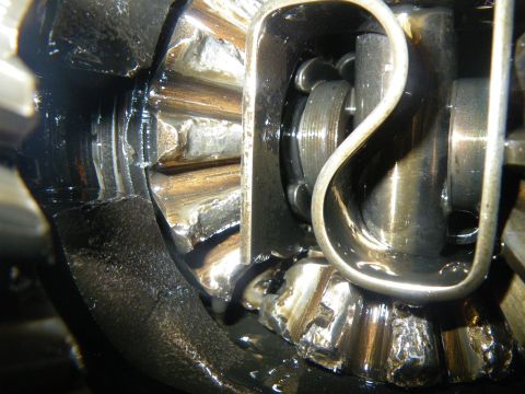 1995 Ford Bronco - Damaged differential gears are visible in this close-up view, coated in oil.