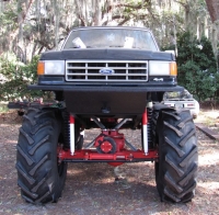 1986 Ford Bronco - Modified 1987 Ford truck on display, extreme lift and massive tires.