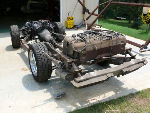 1976 Chevrolet Corvette - The chassis of a car, including the engine and fuel tank, is shown disassembled.