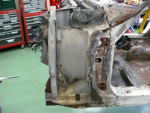 1976 Chevrolet Corvette - This image shows the chassis of a 1976 Chevrolet Corvette, highlighting areas of rust and damage.