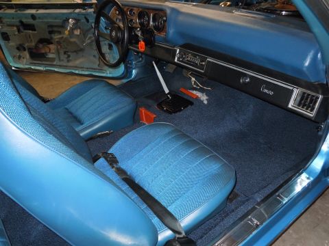 1972 Chevrolet Camaro - Interior view of a 1972 Chevrolet Camaro, highlighting the blue upholstery and dashboard details.