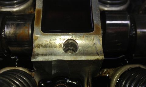 1991 Ford Festiva - Engine part detail showing wear and oil, not a 1991 Ford Festiva.