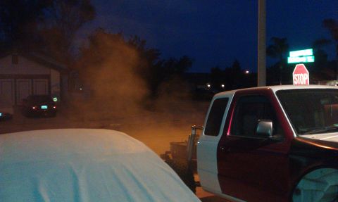 1992 Ford Ranger - A two-tone truck with maroon and white paint is parked outside a house at dusk, with dust in the air.