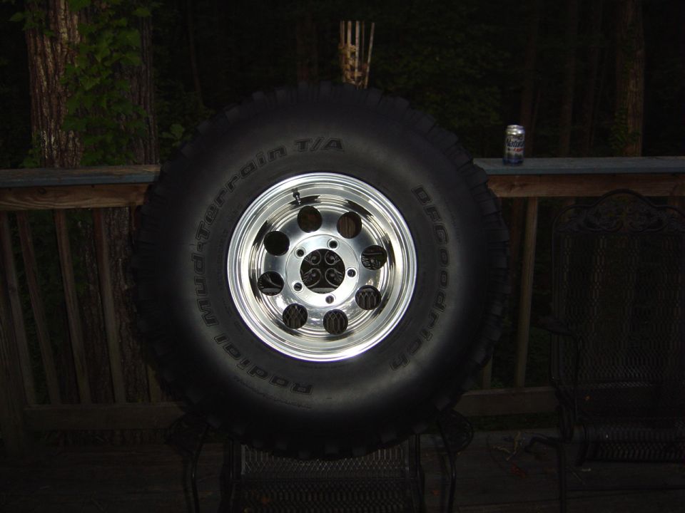 BFGoodrich Mud-Terrain T/A tire on a chrome wheel, sitting on a deck