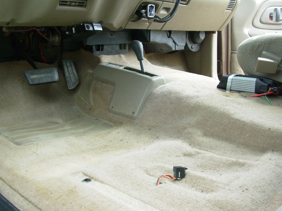 Every truck needs a power inverter, so I'm putting this 750W unit (with USB) under the gap between the seats and routing the wires under the carpet, then up beside the throttle pedal out through a stock filler plug in the firewall.  The inverter was a seasonal item at Sam's, and cost $20.