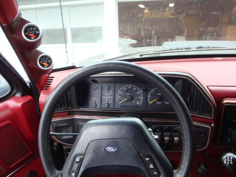 1989 Ford Bronco - Interior view of a 1989 Ford Bronco, showing the dashboard and custom gauges.