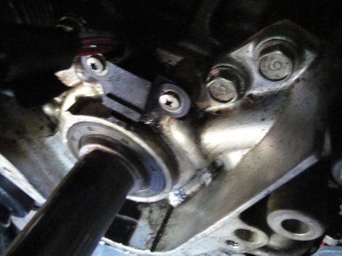 1993 Ford Taurus - Engine part with a sensor and mounting bolts visible.