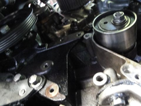 1993 Ford Taurus - Engine components, including pulleys and tensioners, are visible in this close-up shot.