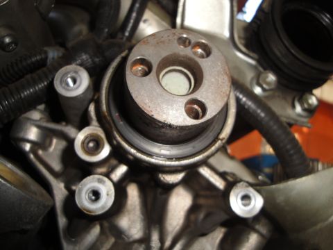 1993 Ford Taurus - Detail of an engine part, showing mechanical components and a seal.