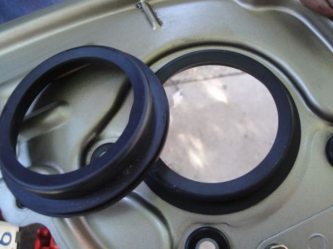 1993 Ford Taurus - Close-up of rubber seals and their mounting area, likely from a vehicle's interior or exterior component.