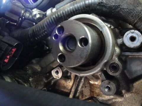 1993 Ford Taurus - Engine water pump housing detail, showing mounting points and a rotating flange.